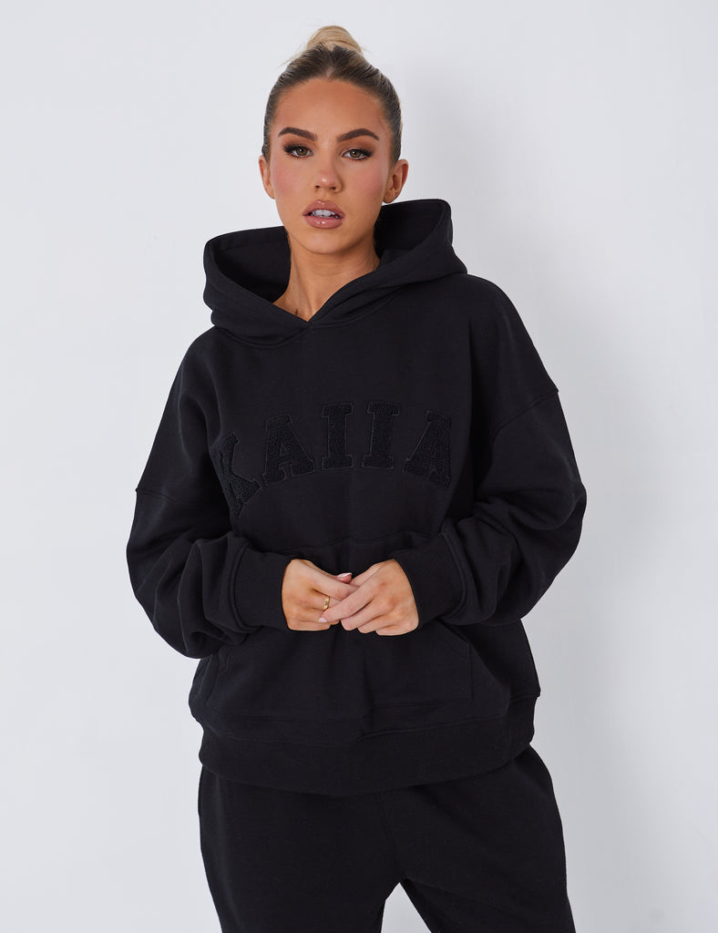 Kaiia Slogan Oversized Hoodie Black | Public Desire