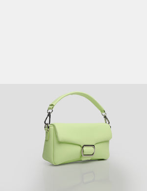 Coach lime green handbag with white leather straps.